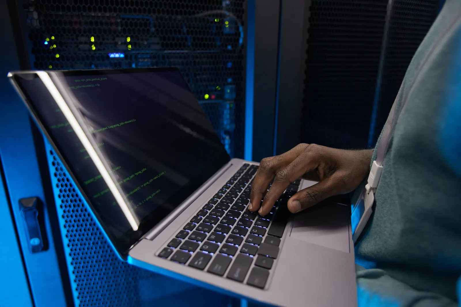 Engineer configuring servers in a data centre